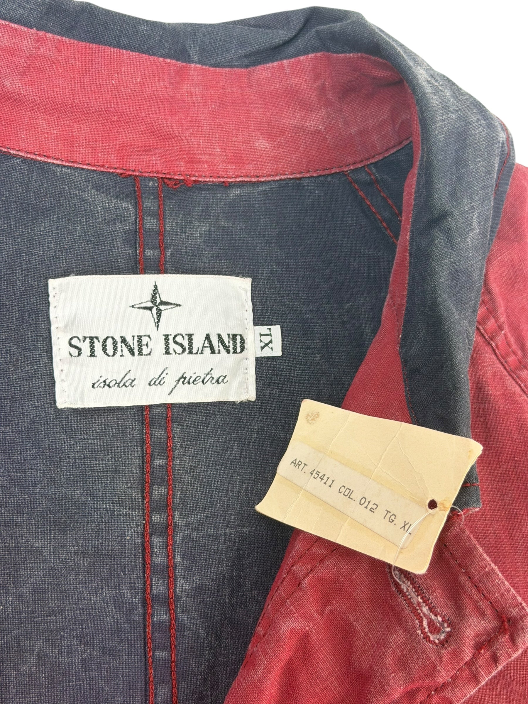 Close-up of a Stone Island label on a red and blue garment.